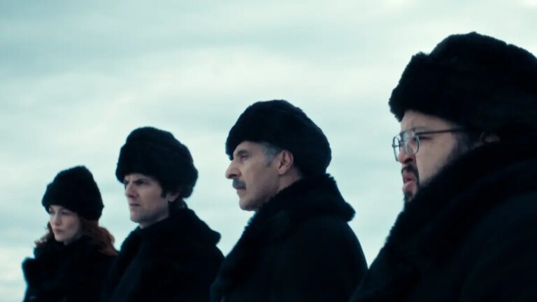 Scene from Apple show "Severance"; 4 people in heavy fur hats
