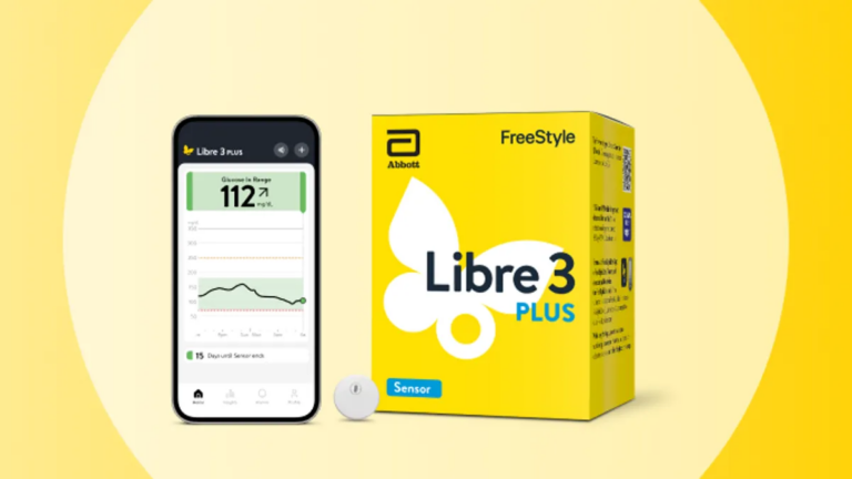 A cell phone displaying the FreeStyle Libre app is next to a Libre 3 Plus box. A Free Style Libre Plus sensor sits between them.