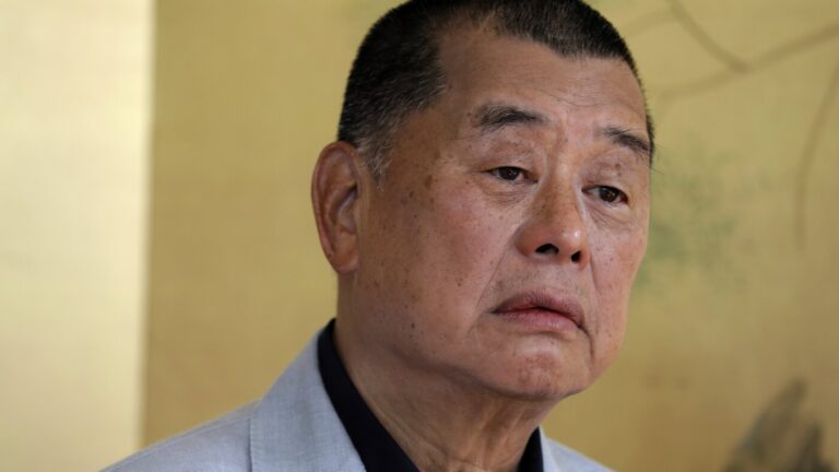 China critic and former media tycoon Jimmy Lai is sentenced to 20 years in a Hong Kong security case : NPR
