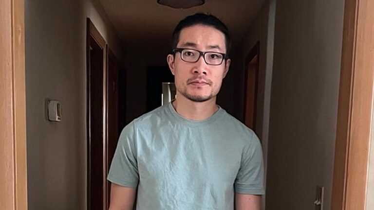 Chinese national who exposed rights abuses is freed from US detention after being granted asylum