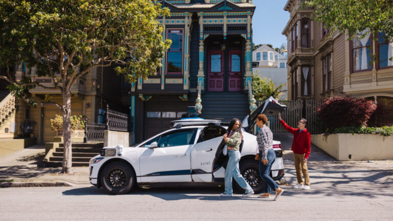 What if riders don’t close a robotaxi door after a ride? Try DoorDash. People getting out of a Waymo robotaxi